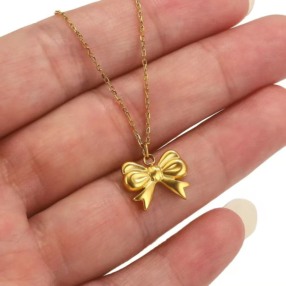 Stainless steel bow - shaped jewelry accessories, DIY necklaces, bracelets, and earrings. There are 5 trendy electroplated bow - shaped pendants.